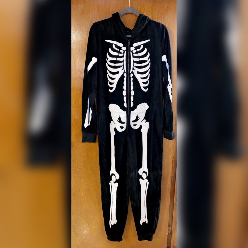 black microfleece onesie with white skelet…